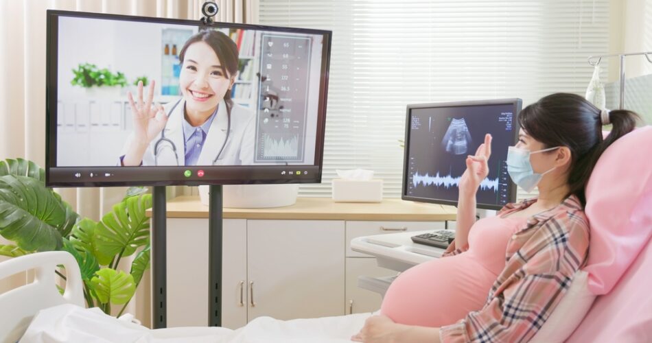 Pregnant Lady on hospital bed